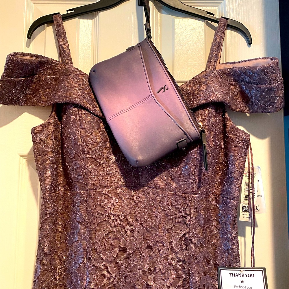 Mauve maxi mother of bride dress with matching clutch.